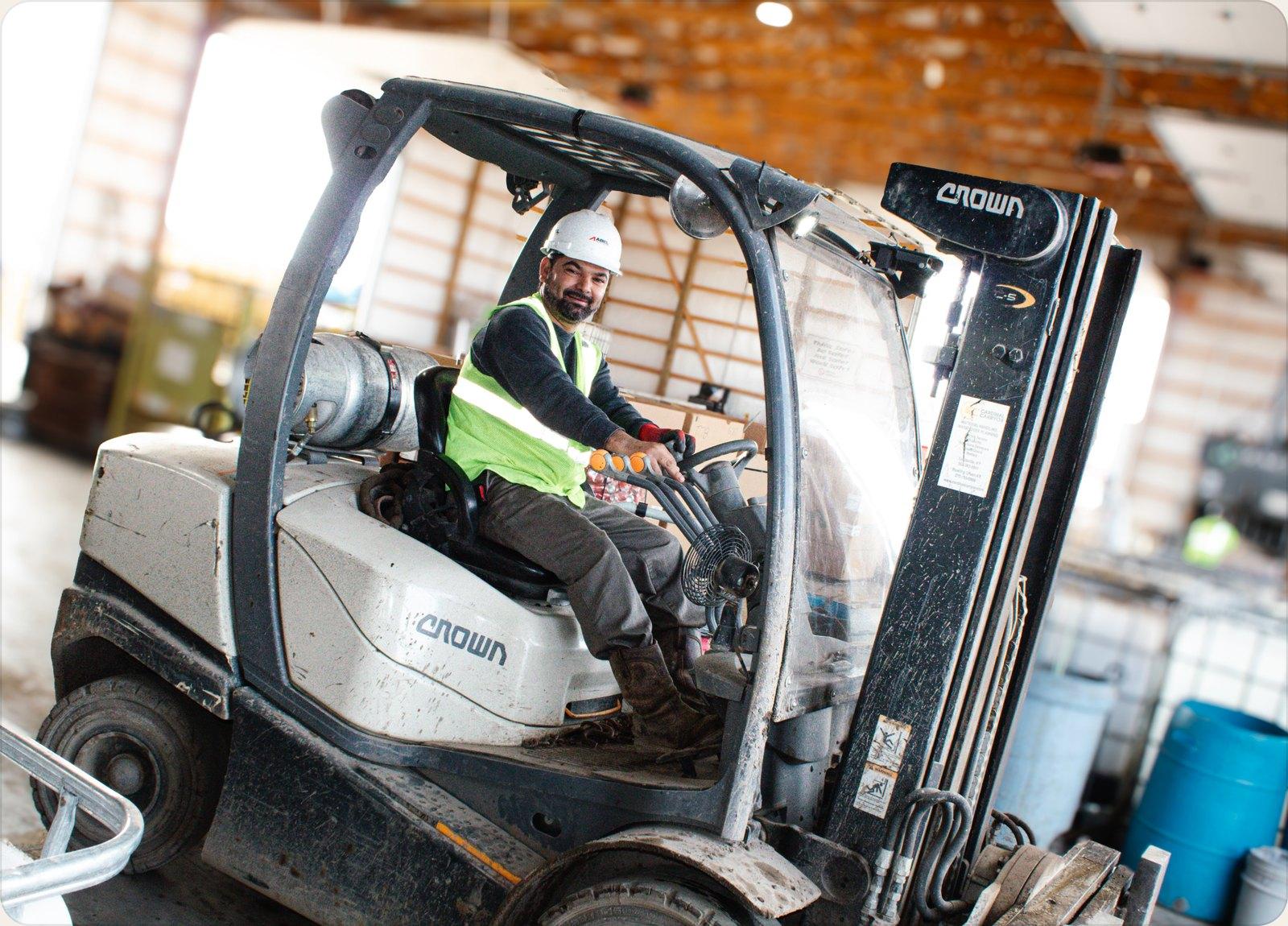 Red Ball Recycling team member operating a forklift inside the Jeffersonville yard